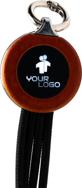 Logotrade Werbeartikel das Foto: 4-in-1-Kabel mit elighted-Logo im Holzgehäuse